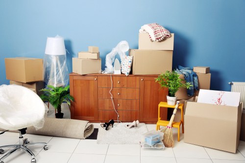 Man with van loading furniture for a local move in Becontreeheath