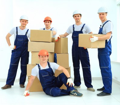 Delivery van and mover completing the final part of a service