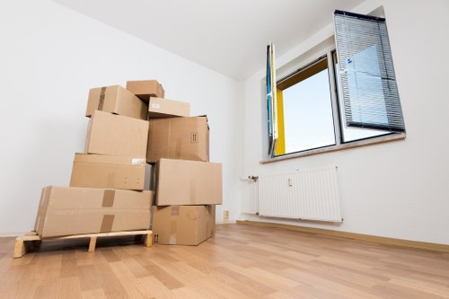 Packed boxes and furniture ready for transport on moving day