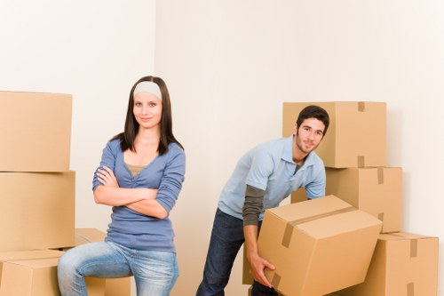 Local movers handling boxes and furniture in Becontreeheath