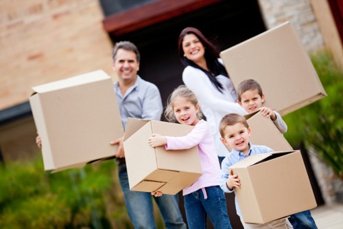 Movers handling desks and IT equipment in a Becontreeheath commercial relocation