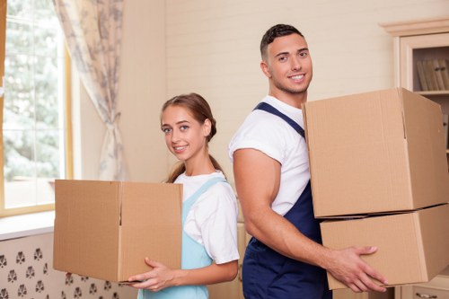 Furniture and household items being transported by a van service